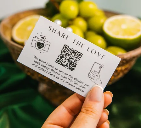 Wedibox QR code card on a reception table