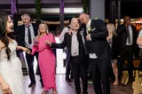 Groom singing with a guest